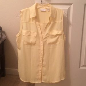 Yellow button down sleeveless blouse